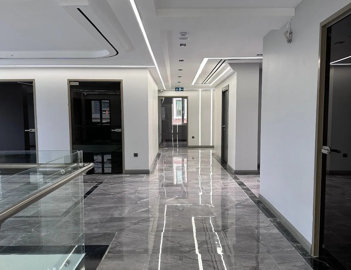 Marble corridor with glass panels at the Global Health Hair clinic in Istanbul